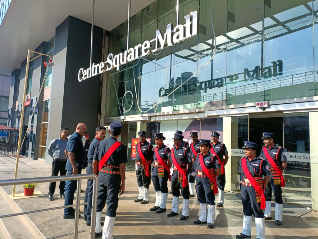 A view of Centre Square Mall in Kerala showcases its modern architecture and vibrant shopping atmosphere. Security guards stand in front of the mall wearing ceremonial dress on Republic Day.